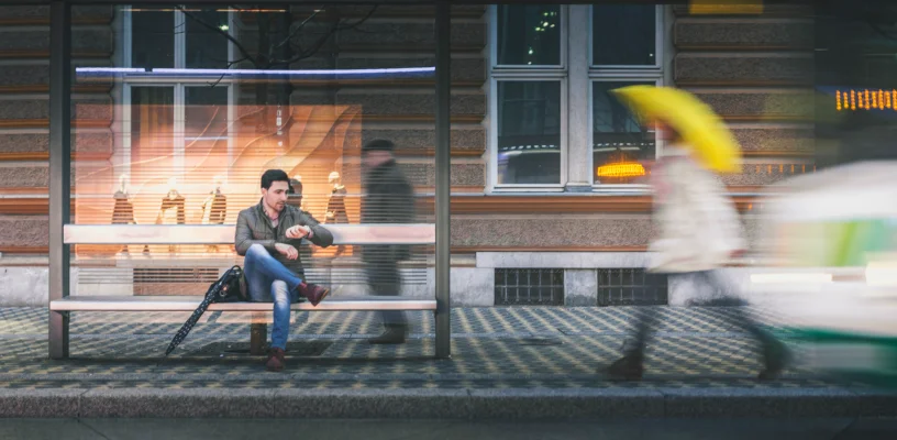 Man waiting at bus stop