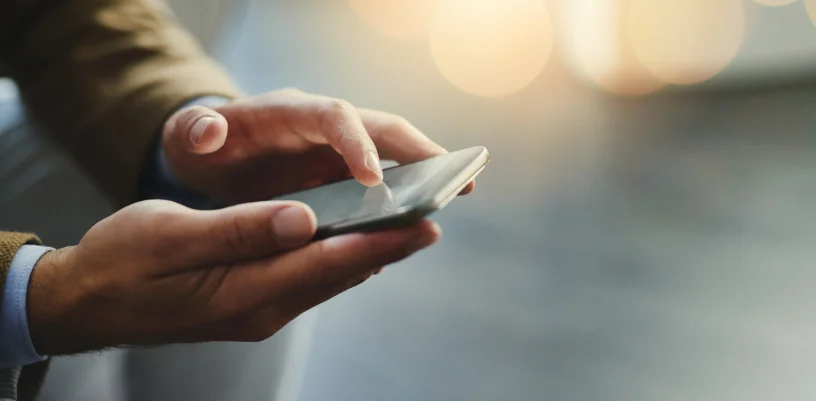 Close up of man using mobile device